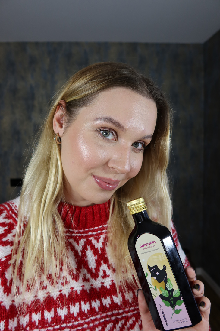 ugc creator smiling and holding a product for clear skin